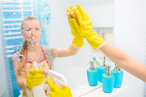 Cleaner checking equipment and floor safety before work resumes